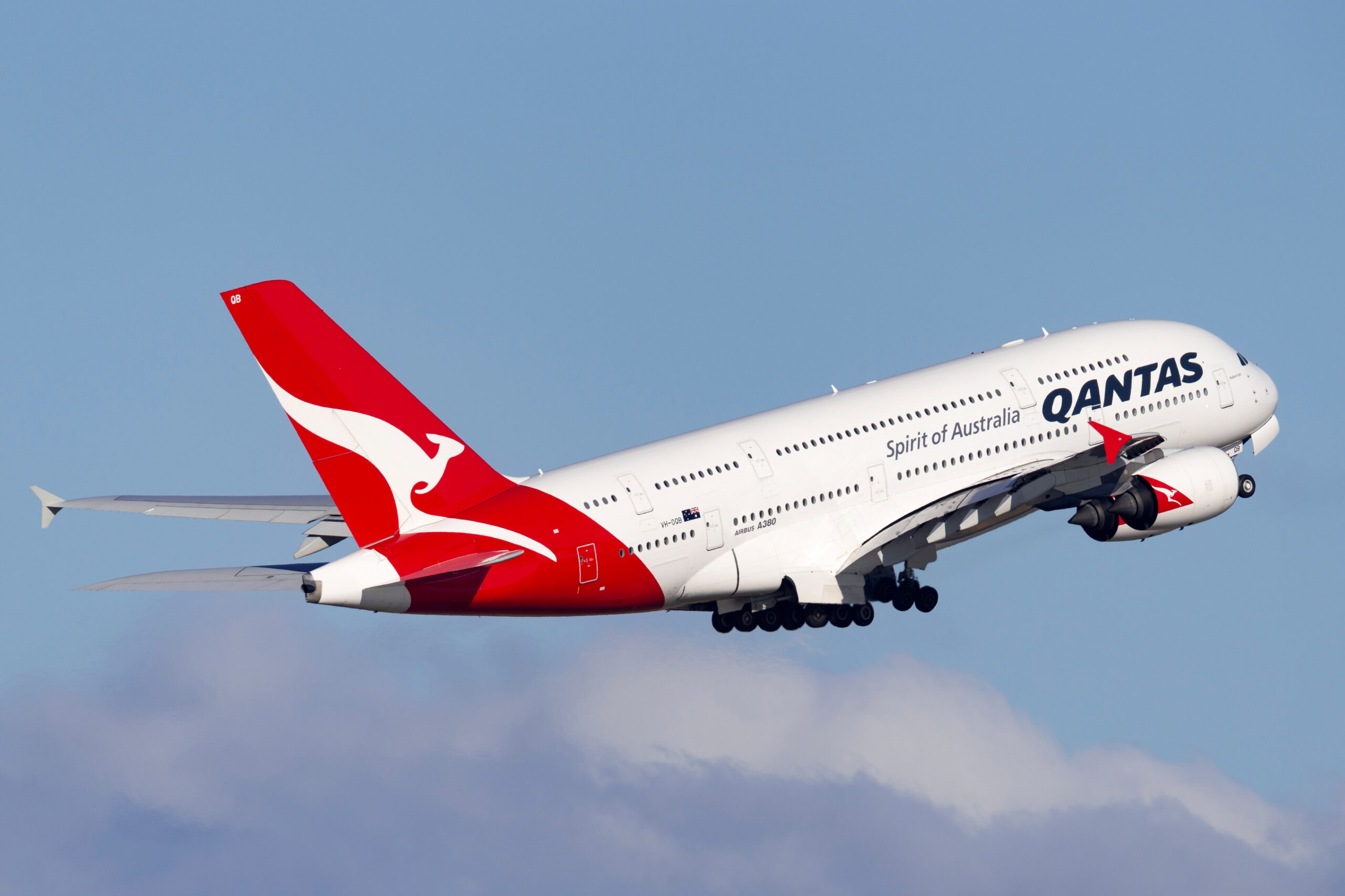 Sydney, Australia – October 8, 2013: Qantas Airbus A380 large four engined passenger aircraft taking off from Sydney Airport. Qantas A380 airplane midair, referencing recent cyber breach impact.